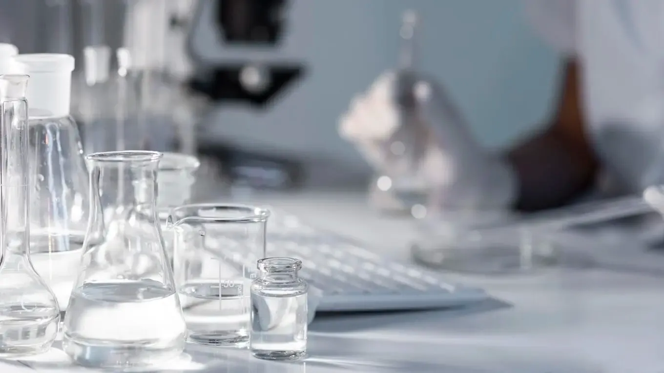 Close Up Blurry Researcher Holding Glassware