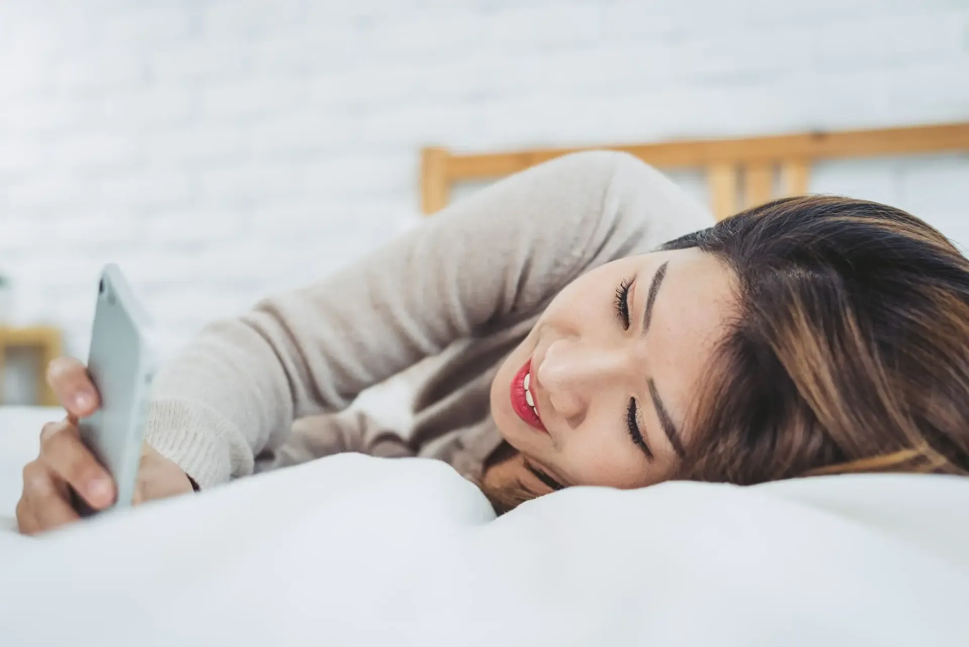 Happy Asian Women Are Using Smart Phone Bed Morning